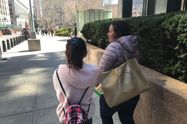 A Central American mother and daughter leaving immigration court at Federal Plaza in Manhattan.